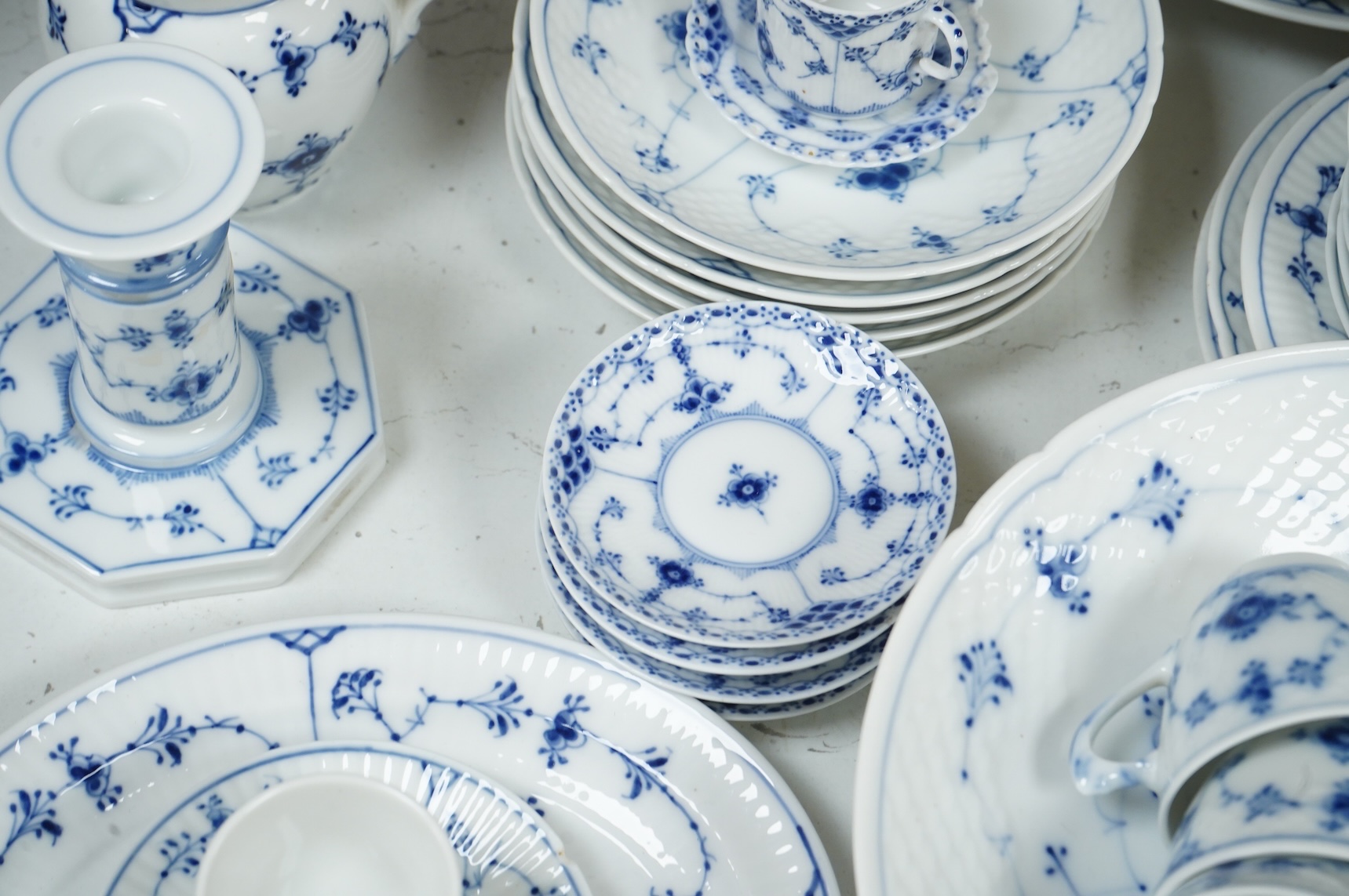 A collection of Royal Copenhagen and Bing & Grondahl onion pattern blue and white tableware